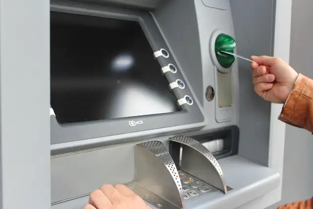Close-up of a self-service kiosk keypad and card slot of the type used for crypto purchases
